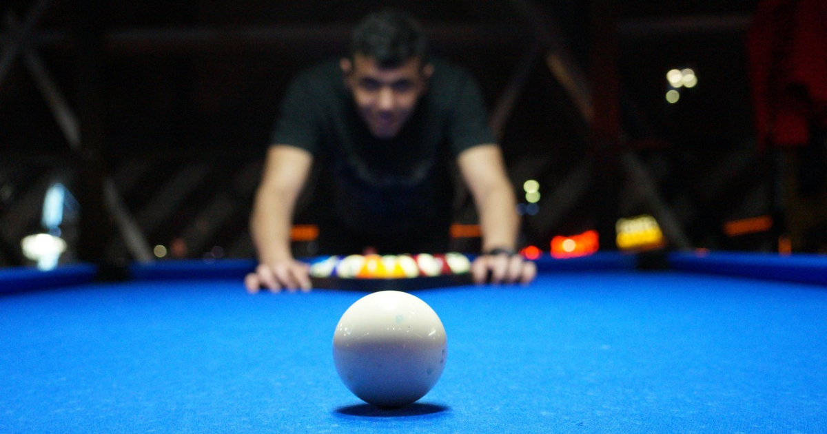Tournament hall with multiple pool tables in play