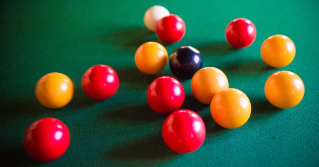 Yellow and red English pool balls