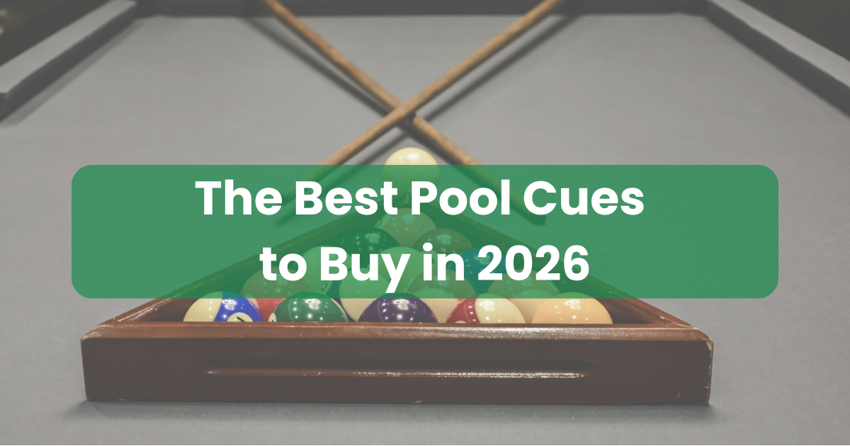 Two pool cues lying on a table set up for a frame